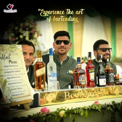 Experience the art of bartending with our professional team. Here are our smiling bartenders, looking sharp in sunglasses and ready to serve at an outdoor wedding event.