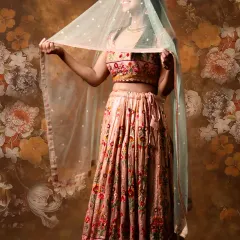 A playful shot showing the delicate net dupatta with sequin work. This lehenga is all about the beautiful details and happy vibes.