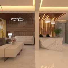 The reception and waiting area of a corporate office, designed to be modern and welcoming. The space features a striking marble reception desk, comfortable lounge seating, and artistic wall panels with integrated lighting.