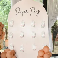 A chic 'Diaper Pong' game board in blush pink with elegant script. I ensure even the games look stylish and cohesive with the overall event decor.