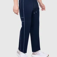 A side view of the sportswear track pants, highlighting the piping detail and the overall silhouette of the garment.