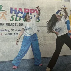 A closer look at the newspaper clipping from the Happy Streets event. Seeing our energy captured like this is always a proud moment.