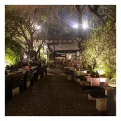 A wide view of the beautiful outdoor seating at the Garden of Five Senses. Our service extends to managing the dining experience in unique and sprawling venues, ensuring every corner feels special.