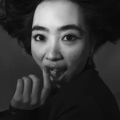 A playful and expressive black and white headshot. Capturing genuine emotion and personality is key to a headshot that gets you noticed.