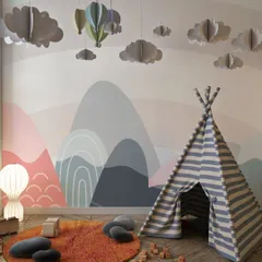 This whimsical children's room is brought to life with our playful mountain and rainbow wallpaper. The soft colors and imaginative design create a perfect space for creativity and fun.