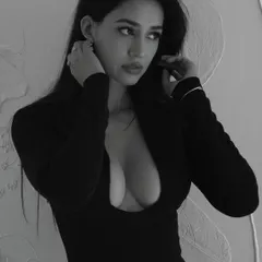 A black and white still of Disha Patani from the music video 'Gustaakh Ishq'. I did both hair and makeup for this shoot, creating a sultry and dramatic look.