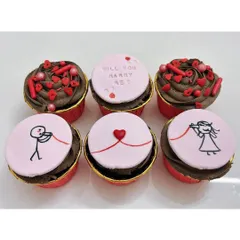 The sweetest way to pop the question! This set of proposal cupcakes tells a story with a stick-figure couple, the red string of fate, and the big question: "Will you marry me?"