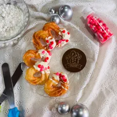 My heart-shaped churros are perfect for celebrations, as seen here on a platter ready for a birthday party. This setup shows how my treats can be the centerpiece of your dessert table, bringing a unique and sweet element to any event.