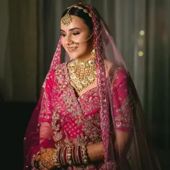 My beautiful bride Aayushii in her stunning pink wedding lehenga. The makeup was kept soft and glowing to complement her outfit, with a focus on defined eyes and a natural lip colour.
