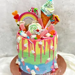 A candy lover's dream, this vibrant rainbow cake is also a piñata. The inside is filled with a candy surprise, and the outside is decorated with lollipops, ice cream cones, and more sweets.