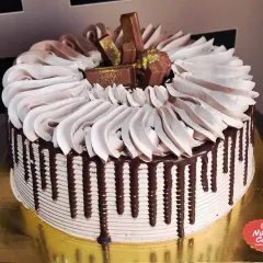 My loaded chocolate drip cake is a bestseller for a reason. This eggless truffle cake is covered in rich chocolate ganache and topped with favorites like KitKat and Ferrero Rocher, making it a dream come true for any chocolate lover.