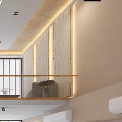 A view of the upper-level mezzanine, overlooking the living area and showcasing the continuity of the design.