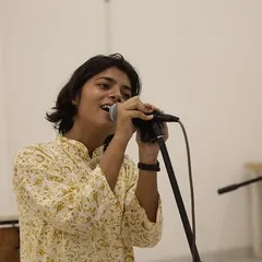 A student sings with passion and emotion during his solo performance at the showcase. These moments of individual expression are a powerful testament to the confidence they've built.