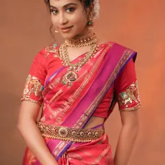 The complete look with the waist belt (vaddanam) adds a traditional touch that is perfect for festive celebrations.