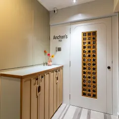 This wider shot shows the complete entryway, with the custom door, personalized nameplate, and functional storage creating a cohesive and inviting first look.