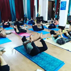 The class works together on Dhanurasana (Bow Pose). This energizing backbend strengthens the back muscles, improves posture, and opens up the chest and shoulders.