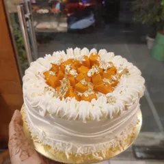 My seasonal fresh mango cake, topped with juicy mango chunks and edible gold leaf. This cake is a customer favorite during the mango season.
