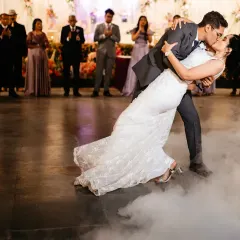A dramatic dip and kiss during the first dance, surrounded by a cloud of dry ice. This is a classic, romantic shot that always looks stunning.