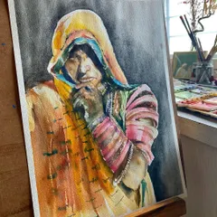 The Rajasthani portrait displayed on my easel. The play of light and shadow on her face and the texture of her clothing were a wonderful challenge to capture in watercolor.