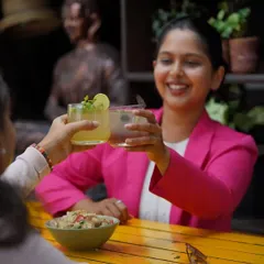 Cheers to teamwork and summer drinks. A regular customer and her colleague celebrate a successful project with some of our refreshing new beverages.