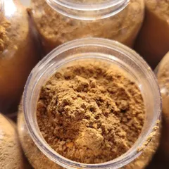 A close-up of the fine texture of my Chocolate Ubtan. It's made from a blend of traditional ingredients that gently exfoliate and nourish the skin.