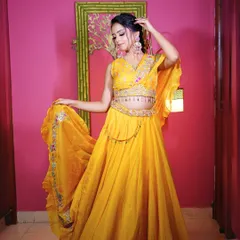 Another full-length shot of the yellow Haldi lehenga, showing its beautiful flow and movement.
