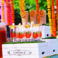 Why serve a Bloody Mary in a plain glass? For this lunch event, we used these fun glasses printed with tomatoes and served them with dehydrated orange garnishes and personalized stirrers.