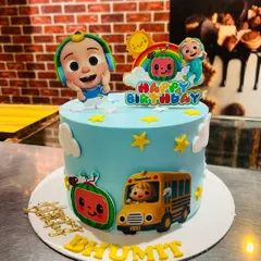A single-tier Cocomelon cake for Bhumit, featuring JJ, the iconic school bus, and a watermelon, all made with bright, kid-friendly colors.