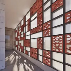 A simple transformation can make a huge impact. Here, we designed a modern jali screen wall to elevate an entrance corridor, playing with light and shadow to create a beautiful first impression.