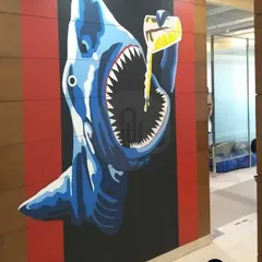 A thrilling 3D selfie wall in Faridabad, featuring a shark pouring a drink into its mouth. This kind of fun, interactive art is perfect for bars or entertainment venues.