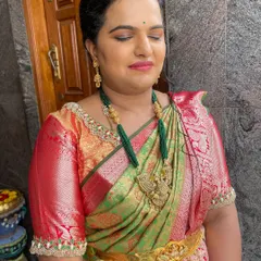 Vidhya celebrating her housewarming ceremony. I gave her a classic look with a defined eye and a warm lip color to match her beautiful green and red silk saree.
