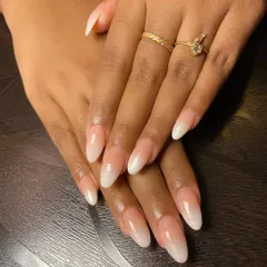 A subtle and chic nail look. These ombre nails have a hint of pearl shimmer, giving them a beautiful, iridescent glow that is both simple and sophisticated.