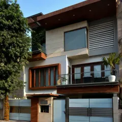 The Gupta Residence in Punjabi Bagh is designed for three generations. The elevation is a composition of interlocking blocks, creating multiple terraces that encourage outdoor interaction and optimize natural light on the north-west facing site.