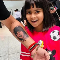 There is nothing more special than capturing a loved one in a permanent portrait. We worked closely with this client to create a realistic tattoo of his daughter, focusing on her joyful expression. Seeing the finished tattoo next to her photo shows the level of detail and likeness we strive for in our portrait work.