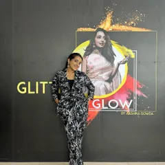 A confident moment in front of my brand logo. My goal is to empower all my students with the skills and confidence to succeed in makeup artistry.