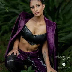 A full-body shot of the purple velvet co-ord set, showing the texture of the fabric and the flattering fit of the pants.