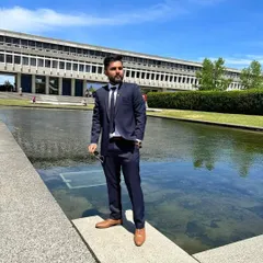 The same navy blue formal suit from a different angle. A custom fit means the suit looks good whether you are standing still or on the move.