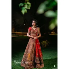A stunning full-length portrait of Sharvari at her reception. The rich colors of her lehenga were paired with a soft, open hairstyle and glowing makeup for a timelessly elegant look.