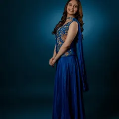 A happy, smiling shot that shows the versatility of the outfit, perfect for both formal and celebratory occasions.