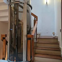 Design that moves you, both literally and aesthetically. For this villa, we integrated a sleek, all-glass vacuum elevator into the stairwell, pairing it with Indonesian walnut treads and an architectural concrete wall. It’s a statement of how we merge innovative technology with timeless materials for luxury and comfort.