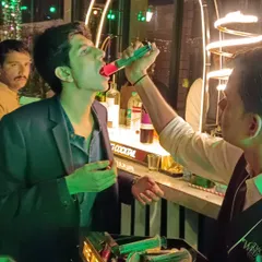 The syringe shots are always a hit. My bartender is seen here serving a shot directly to a guest, making it a fun and interactive part of the celebration.