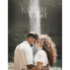 An intimate portrait in front of the majestic Devkund waterfall, blending the power of nature with the couple's connection.