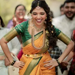 The joy of a bride who is completely herself. This is the vibe I love to create with my designs, ensuring you feel comfortable, confident, and radiant on your big day.