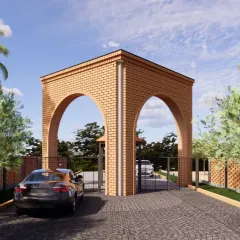 The entrance to Ekadanta, a 41-acre sustainable farming community I am designing. The arched gateway, built with local bricks, sets the tone for a development where architecture respects the land and fosters a sense of community.