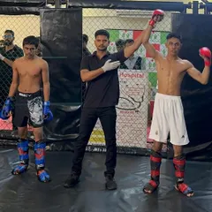 A decisive first-round finish. Our fighter locked in a perfect rear-naked choke, proving that superior ground game ends fights. This is the technical excellence we drill every day.