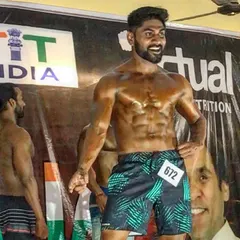 On stage, under the lights. All the hours of silent work in the gym and discipline in the kitchen lead to this moment.