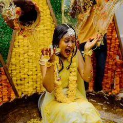 The Haldi ceremony is all about joy and vibrant colors. We designed this fun and traditional setup with a backdrop made of marigold flowers and a large decorative Urli for the ceremony, ensuring every photo is full of life.