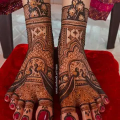 Peacock love for the feet. This design features bold peacocks as the central motif, surrounded by delicate patterns that create a beautiful contrast. The rich stain is simply gorgeous.