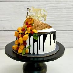 This is my most viral creation, the gravity-defying mango cone cake. It’s a perfect example of how I mix creative designs with delicious, fresh fruit flavors for a truly unique anniversary or birthday cake.
