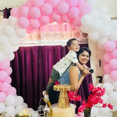 A playful moment with my son during my daughter's birthday party. The joy on his face is priceless.